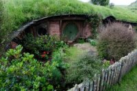 Image shows a hobbit hole from the filming of The Lord of the Rings.