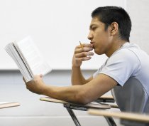 Ruben Padilla Jr. reads the 2007 sci-fi novel “Unwind” by Neal Shusterman in an English class at Glenbrook South High School in Glenview.